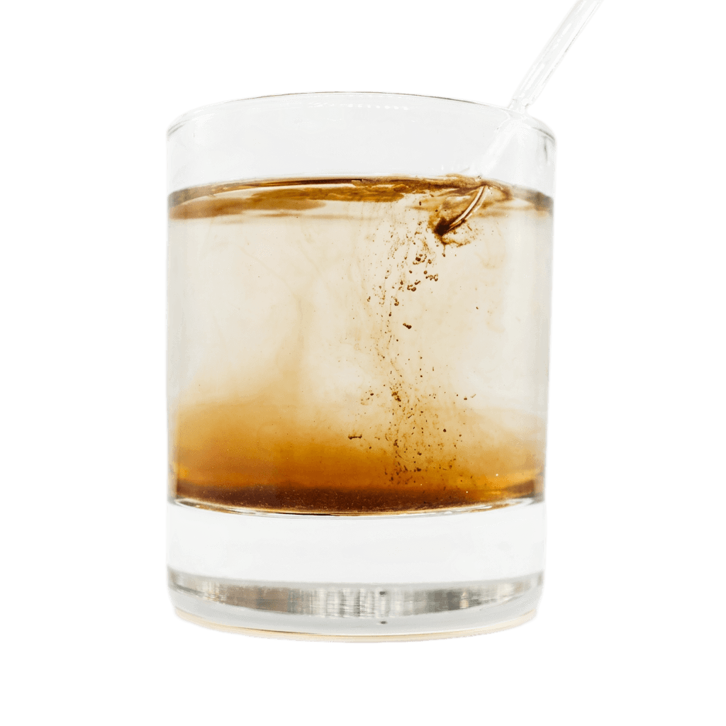 Shilajit resin dissolving into warm water